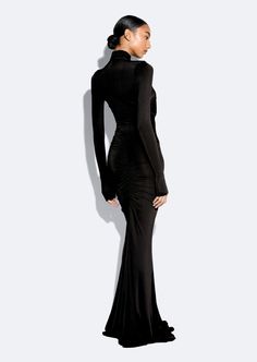 Featured In The Fall 2024 Collection This stretch jersey halter neck gown features a center front cut out and ruching throughout with an invisible zipper at center back. Materials: 61% Acetate, 39% Viscose Care: Machine Wash Cold Fit: True to Size Model is 5'10" and Wearing a S Fitted Evening Maxi Dress With Ruched Sides, Ruched High Neck Maxi Dress For Evening, High Neck Ruched Maxi Dress For Evening, Sleek Fitted Ruched Maxi Dress, Fitted High Neck Ruched Maxi Dress, Fitted High Neck Maxi Dress With Ruched Details, Ruched Gown, Halter Neck Gown, Cold Fits