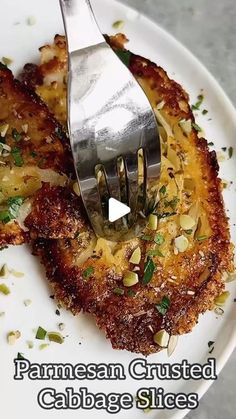 a fork is stuck into some food on a plate with the words parmesan crusted cabbage slices