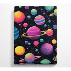 a black notebook with colorful planets on it