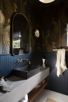 a bathroom with two sinks and a large mirror above the sink in front of it