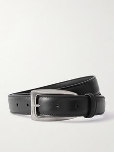 The Row's understated 'Arco' belt will work with everything from the label's chunky knitwear to slick tailoring or jeans. It's been made from supple black leather and has a silver buckle. Timeless Black Belt For Workwear, Timeless Black Belt For Work, Timeless Black Leather Belt Buckles, Timeless Black Belt Buckles For Workwear, Fitted Black Leather Belt, Sleek Black Belt For Workwear, Sleek Black Belts For Work, Sleek Leather Belt Buckles For Workwear, Designer Fitted Black Belt