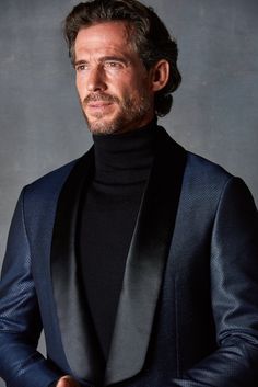 The essential dinner jacket is a statement-making formal garment that is festive, stylish and chic. Cut from a luxurious blend of wool and viscose - this jacket is smooth to the touch and shimmers every so beautifully in evening light. If you're looking for a stylish jacket that can be used for black tie, Holiday parties and epic evenings out - this is an excellent choice. Whenever you need to add a little style punch to "black tie", pull this one out and let the compliments - and refreshments - Elegant Long Sleeve Evening Suits, Luxury Suits With Suit Collar For Fall, Luxury Fall Suits With Suit Collar, Elegant Long Sleeve Evening Blazer, Elegant Tailored Tweed Jacket For Winter, Sleek Evening Suits With Long Sleeves, Sleek Evening Suits, Sleek Long Sleeve Evening Suits, Tailored Blazer With Lapel Collar For Evening