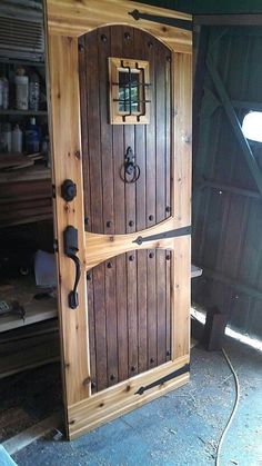 an open wooden door in the middle of a room