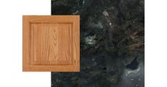 an image of a wooden cabinet door with black marble in the background and wood grain on the floor