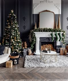 a living room filled with furniture and a christmas tree in front of a fire place