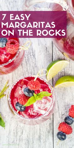 two glasses filled with raspberry margaritas on the rocks