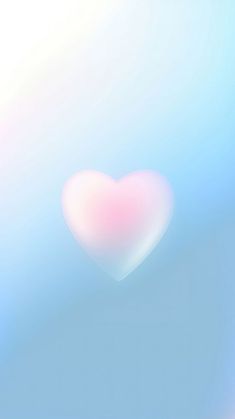 a blurry image of a pink heart on a blue and white background with the sky in the background