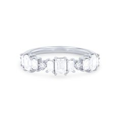 three stone diamond ring with baguetts in white gold, set on a plain band