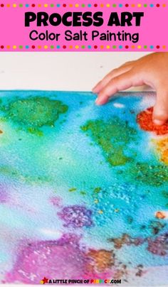 a child's hand on top of a painting with the words process art color salt painting