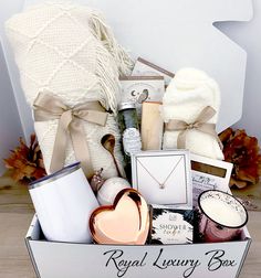 the royal luxury box is packed with candles, soaps and other personal care items