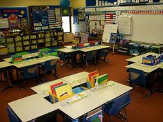 an empty classroom with desks and chairs