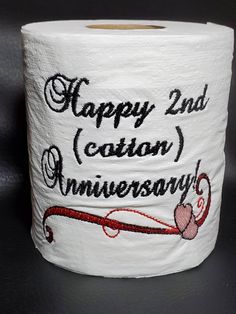 a roll of toilet paper with the words happy 2nd canon anniversary written on it,