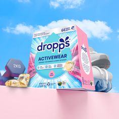 a box of dropps activewear sitting on top of a pink wall