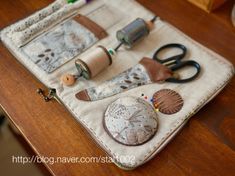 an assortment of crafting supplies sitting on top of a table