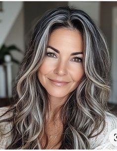 Selecting the best gray highlights for brown hair over 50 depends on factors like skin tone, hair texture, and personal style preferences. Cooler gray tones, such as ash or silver, work well with darker shades of brown, adding a striking contrast that brightens the complexion. Warmer gray hues, like soft pewter, can complement light brown hair by creating a harmonious blend. The placement of the highlights also matters; adding them around the face can enhance facial features, while all-over high Dark Brown To White Hair, Best Hair Color For Going Gray, Grey To Brown Ombre Hair, Dark Hair With White Highlights Underneath, Brazilian Blowout On Grey Hair, Womens Salt And Pepper Hair, Best Hair Colors For Greying Hair, Gray Highlights Dark Hair, Cool Blonde Grey Blending