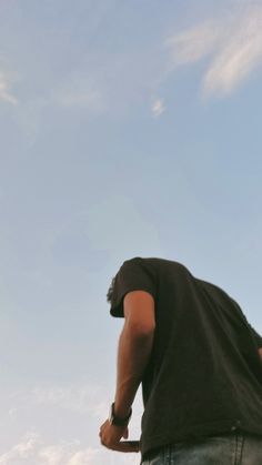 a man flying a kite high in the sky