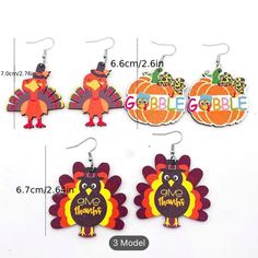 the turkey earrings are designed to look like they have thanksgiving decorations on them