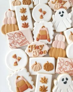 decorated cookies are arranged in the shape of pumpkins, ghostes and other decorations