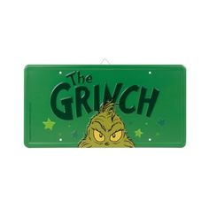 a green sign that says the grin on it