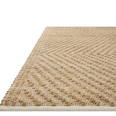 an area rug made out of jute, with small holes in the center and bottom