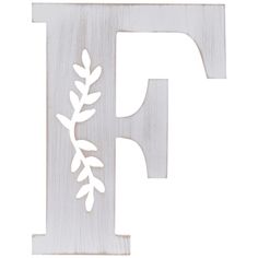 the letter f with leaves on it is white and has a wooden frame in the shape of a leaf