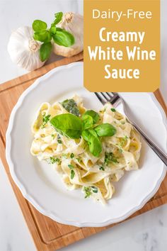 creamy white wine sauce on a plate with garlic and basil