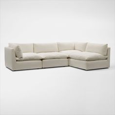 Pillowy soft with a modern style. The Lola 4-Piece Sectional and Ottoman Set elevates your space with minimalist detailing, cloud-like comfort and oversized seating you just want to burrow in. | Lola 4-Piece Sectional in Ivory | by Value City Furniture Sectional Living Room Decor, Cream Sectional, Sectional And Ottoman, Long Couch, White Sectional, 3 Piece Sofa, Cozy Couch, American Signature Furniture, Value City Furniture