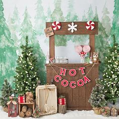 a christmas display with candy canes and other holiday decorations in front of a backdrop