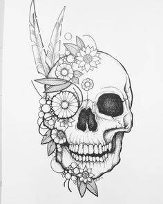 a drawing of a skull with flowers and feathers on it