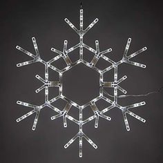 PRICES MAY VARY. [ 36” SNOWFLAKE DECORATION with COOL WHITE NON-TWINKLE LED LIGHTS ] 36-inch folding snowflake decoration lit with 105 cool white steady LED lights. 42-inch power cord with fused stackable male plug and 5-inch tail with female plug for end to end connections. [ FOLDING DESIGN for CONVENIENT USE ] Durable, lightweight polypropylene frame snaps open for display, folds closed for compact storage. 2-SIDED; lights can be seen from both sides. IDEAL FOR HANGING DISPLAY with string or c Large Snowflake Decorations, Snowflake Christmas Lights, Snowflake Decor, Snowflake Decoration, Holiday Lights Display, Snowflake Lights, Outdoor Light Bulbs, Novelty Lights, Snowflake Decorations