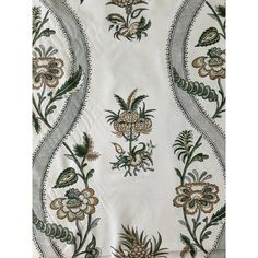 an embroidered fabric with flowers and leaves on white, green and gold colors is shown