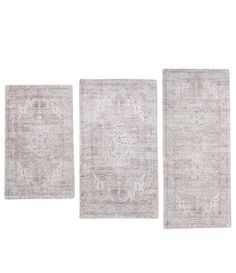 three rugs in different sizes and colors on a white background with no one else