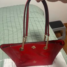 Beautiful Coach Handbag. Used A Few Times. Excellent Condition. One Pocket Outside, 2 Inside Pockets, One Inside Zip Pocket. Hand Leather And Gold Chain. Red Coach Satchel, Red Shoulder Bag With Branded Hardware, Red Coach Bag For Daily Use, Coach Red Shoulder Bag For Everyday, Chic Red Coach Bag, Everyday Red Coach Bag, Red Satchel With Branded Hardware, Red Coach Bag For Everyday, Red Satchel Shoulder Bag With Branded Hardware