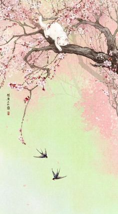 two birds are flying in the air near a tree with pink flowers and leaves on it