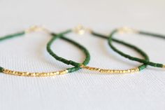 Gold vermeil bracelet - beaded bracelet - christmas bracelet - christmas gift - Friendship bracelet This Dainty Bracelet is very elegant and delicate perfect for a christmas gift or a special day or for an everyday look!!You can wear it alone or stack it with bracelets!!It can make a perfect gift for your bridesmaids!! It is made with: ✪ Tiny Seed Beads, you can choose your color!! ✪ Tiny gold vermeil faceted nugget beads ( Pure silver. ✪ Gold plated clasp. The measurement is aprrox 17cm but you Green Beaded Bracelet For Holiday, Handmade Green Beaded Bracelets For Holidays, Green Beaded Bracelet For Gift, Green Beaded Chain Bracelets As A Gift, Green Beaded Chain Bracelets For Jewelry Making, Festive Green Beaded Bracelets With Colorful Beads, Elegant Green Round Beads Friendship Bracelets, Green Beaded Chain Bracelet For Gift, Green Beaded Bracelets For Festive Occasions