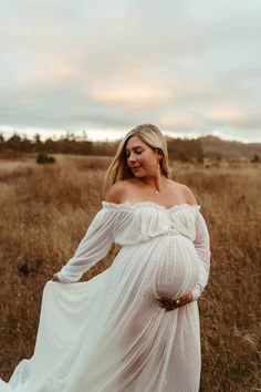 Details:~Asymmetrical rainbow moonstones.~Gold-filled.~Hand hammered oval hoops.~French hooks.~Hoops measure 2 1/2" in length.~Hoops measure approximately 2” in diameter at their largest point. -- inspired by the "droplet" shape that morning dew leaves behind in my garden. Pregnant Woman Poses, Maternity Pictures With Dress, Outside Maternity Shoot, Mother Daughter Maternity, Maternity Picture Ideas, Cute Pregnancy Photos, Winter Maternity Photos, Fall Maternity Photos, Maternity Photography Poses Outdoors