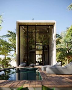 an outdoor swimming pool with lounge chairs and palm trees in the backgrounge