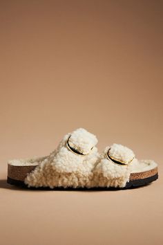 Teddy shearling upper, insole Cork-latex sole Slip-on styling Imported | Arizona Big Buckle Teddy Sandals by Birkenstock in Beige, Women's, Size: 37, Shearling/Cork-Latex at Anthropologie Birkenstock Arizona Big Buckle, Faux Fur Sandals, Arizona Big Buckle, Fur Sandals, Fuzzy Slippers, New Today, Socks And Sandals, Birkenstock Arizona, Birkenstock