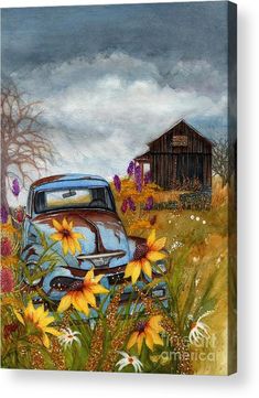 an old blue truck parked in a field with yellow flowers and a barn behind it