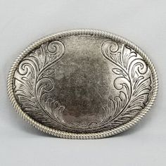 Vintage Belt Buckle Floral Scroll Filigree Western Oval Unisex Silver Color. Normal Wear And Tear Due To Age And Use. Fits a 1-5/8" belt. Very Well Made. This is a beautiful vintage western belt buckle, featuring a stunning floral scroll design in a classic oval shape. The silver-tone finish gives it a timeless and elegant look. This versatile buckle is perfect for both men and women and can be dressed up or down. It's in excellent condition for its age, with only minor signs of wear. This buckle would make a great addition to your western wear collection or a unique and stylish gift. SAVE SAVE SAVE SAVE SAVE SAVE Buy any 2 buckles and take 10% off with code SAVE10SSBB. Buy any 3 buckles and take 15% off with code SAVE15SSBB. Buy any 4 buckles and take 20% off with code SAVE20SSBB. Luxury Vintage Adjustable Belt Buckles, Western Vintage, Western Belt Buckles, Silver Belt Buckle, Western Belt, Vintage Belt Buckles, Vintage Belt, Western Belts, Scroll Design