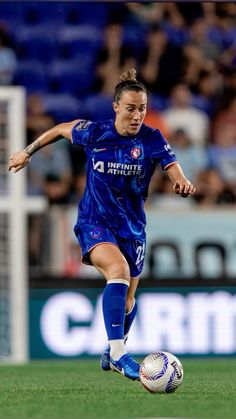 a female soccer player in action on the field