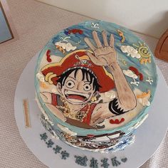 a decorated cake with an image of a pirate on it