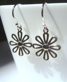 This listing is for shiny sterling silver flowers that hang on sterling silver ear-wires.  There are some minor differences in the petals and they are not perfectly symmetrical. The flowers are about 14mm wide. Here are more flowers in my shop: https://www.etsy.com/shop/phoebestreasure?ref=listing-shop2-all-items-count&search_query=flower Sterling Silver Teardrop Pierced Flower Earrings, Sterling Silver Flower Charm Earrings, Sterling Silver Flower-shaped Earrings, Sterling Silver Flower Charm Earrings As Gift, Dainty Sterling Silver Flower Earrings, Silver Flower Charm Earrings, Nickel-free Sterling Silver Teardrop Flower Earrings, Silver Teardrop Flower Earrings In Sterling Silver, Delicate Sterling Silver Flower Earrings With Ear Wire