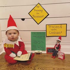 there is a baby elf sitting on the floor