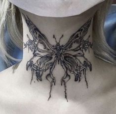 a woman's neck with a butterfly tattoo on her neck and the back of her neck