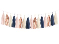 tasselled garland with different colors and fringes hanging from the string on a white background