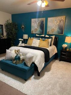 a bedroom with blue walls, white carpet and black bedding is pictured in this image