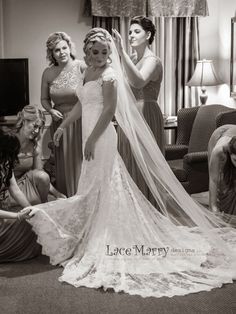 the bride is getting ready for her big day at the wedding ceremony in black and white