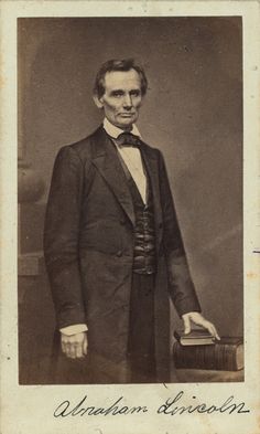 an old black and white photo of a man in a suit