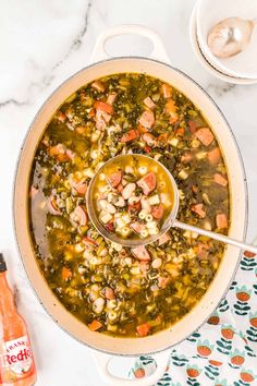 a large pot filled with soup and vegetables